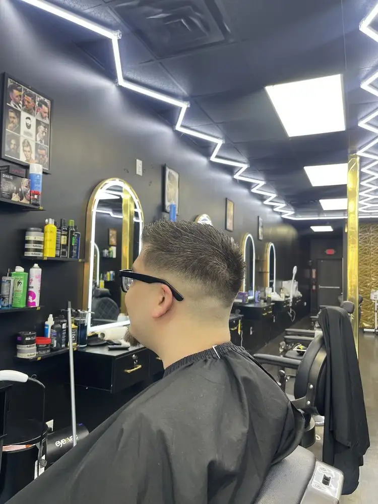 A fresh fade in the mirror, side view