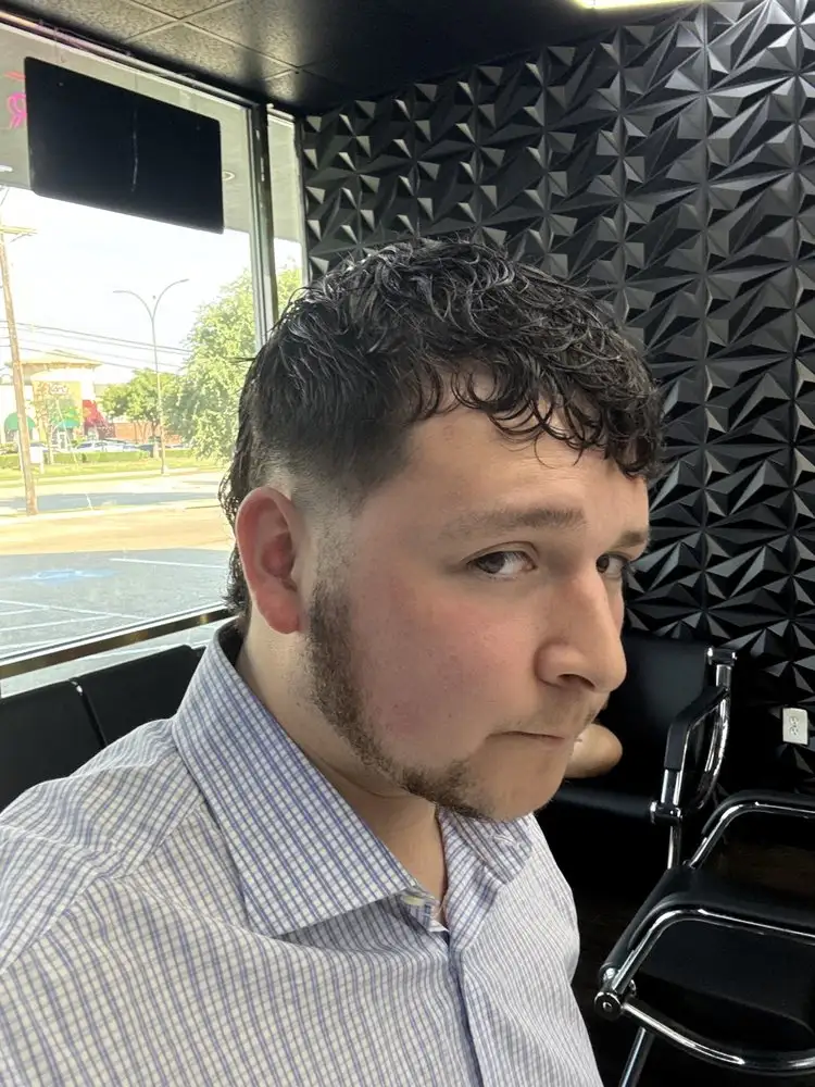 A client's curly cut, photographed in the shop
