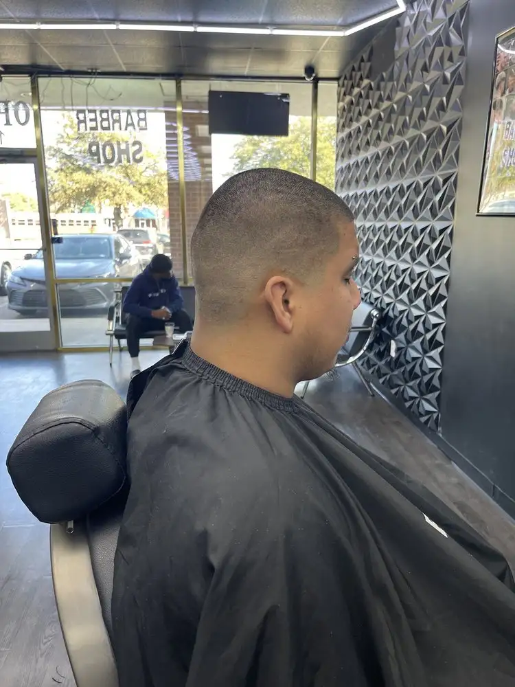 A short buzz cut, side view